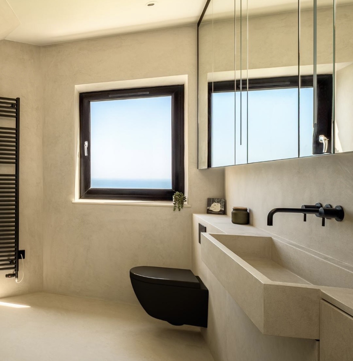 Micro cement bathroom with seamless walls and countertop